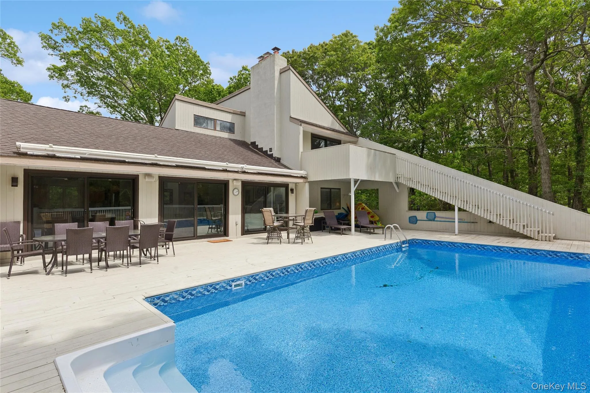 Swimming pool featuring outdoor dining space Swimming pool featuring outdoor dining space