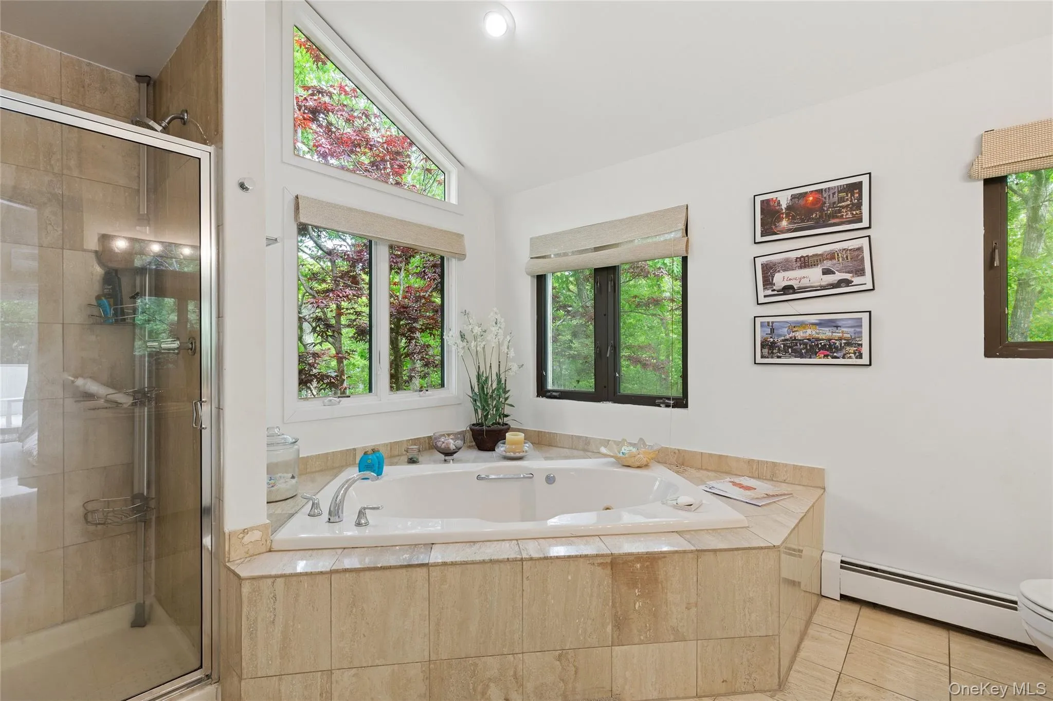 Full bathroom featuring a baseboard radiator, a shower stall, a whirlpool tub, toilet, and tile patterned floors Full bathroom featuring a baseboard radiator, a shower stall, a whirlpool tub, toilet, and tile patterned floors