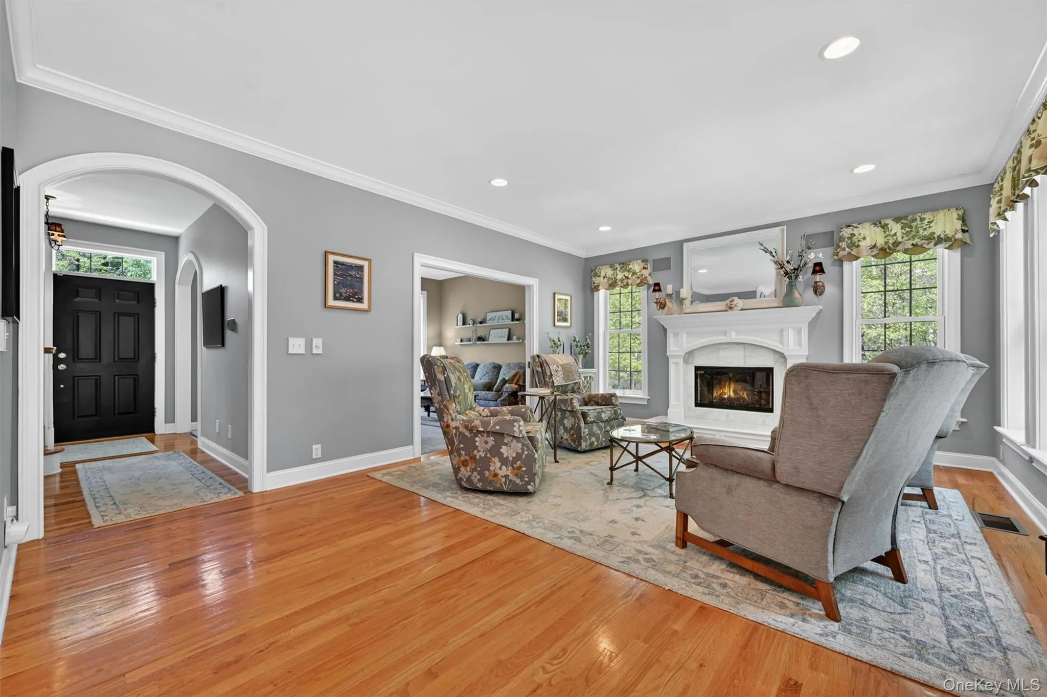Family room with hardwood floors and fireplace Family room with hardwood floors and fireplace