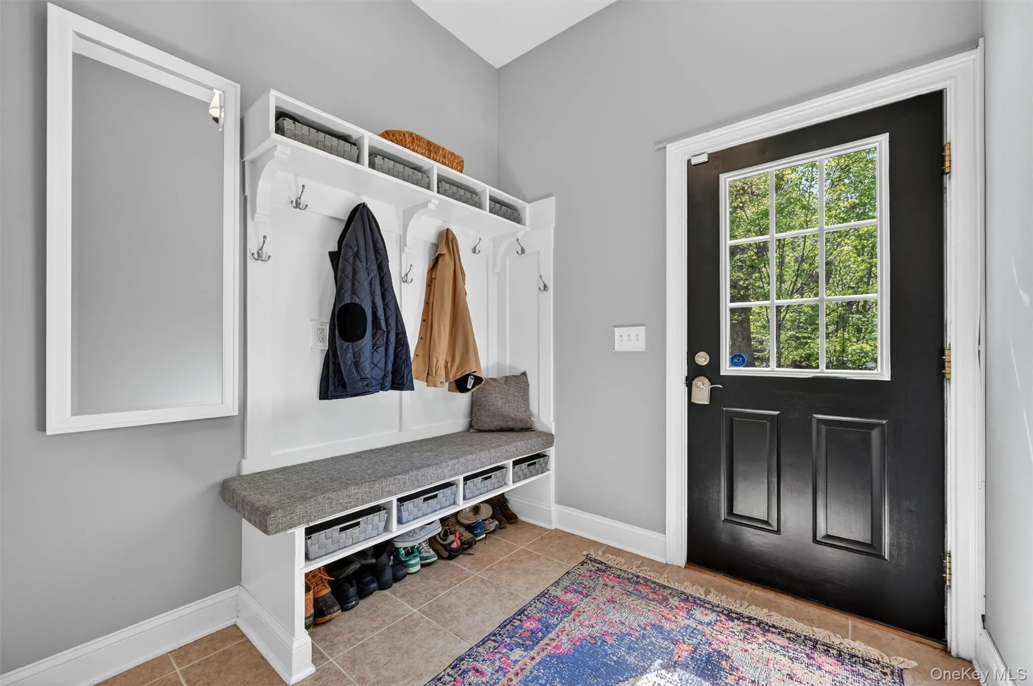 Side door entry mudroom with built in bench for convenience, coat hangers and closet Side door entry mudroom with built in bench for convenience, coat hangers and closet