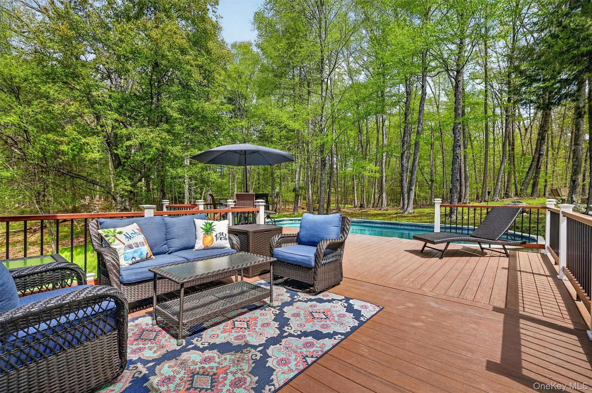 Deck to pool and place for a sitting area Deck to pool and place for a sitting area