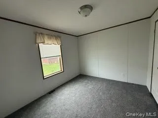 View of carpeted empty room View of carpeted empty room
