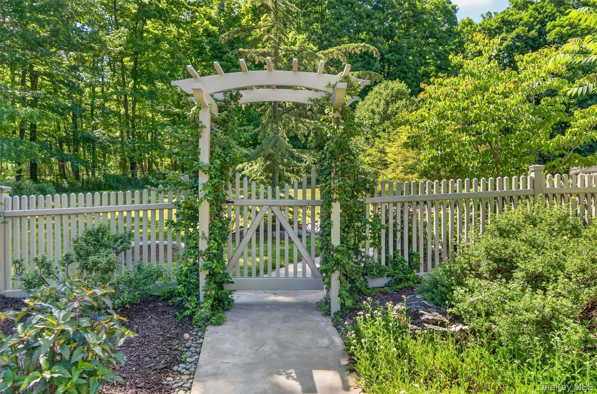 Side walkway entrance to the backyard oasis Side walkway entrance to the backyard oasis