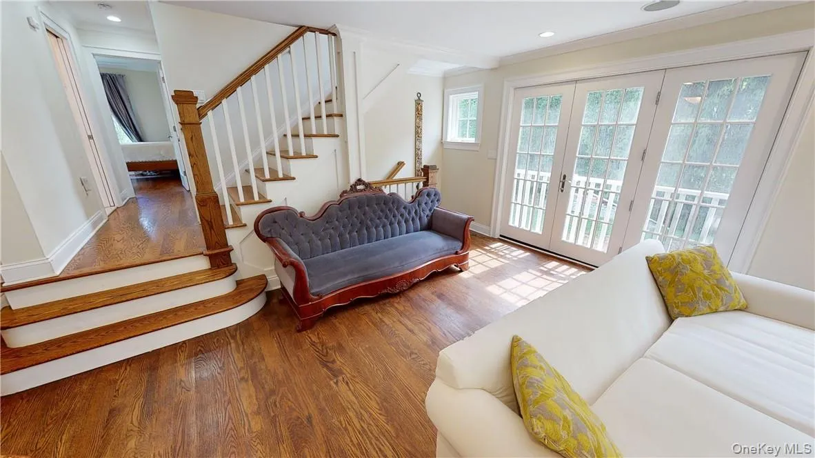 Beautiful wood work throughout home. Thoughtfully designed staircase separates living and sleeping areas. Beautiful wood work throughout home. Thoughtfully designed staircase separates living and sleeping areas.