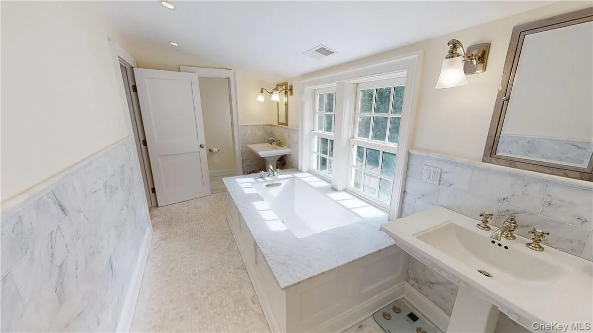 Beautiful primary suite bath with toilet room, shower room, and deep soaking tub - all with Waterworks high-end finishings Beautiful primary suite bath with toilet room, shower room, and deep soaking tub - all with Waterworks high-end finishings