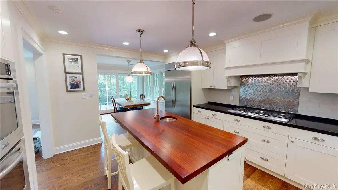 Modern hi-end chef's kitchen with stainless appliances and Bilotta custom kitchen cabinetry. Modern hi-end chef's kitchen with stainless appliances and Bilotta custom kitchen cabinetry.