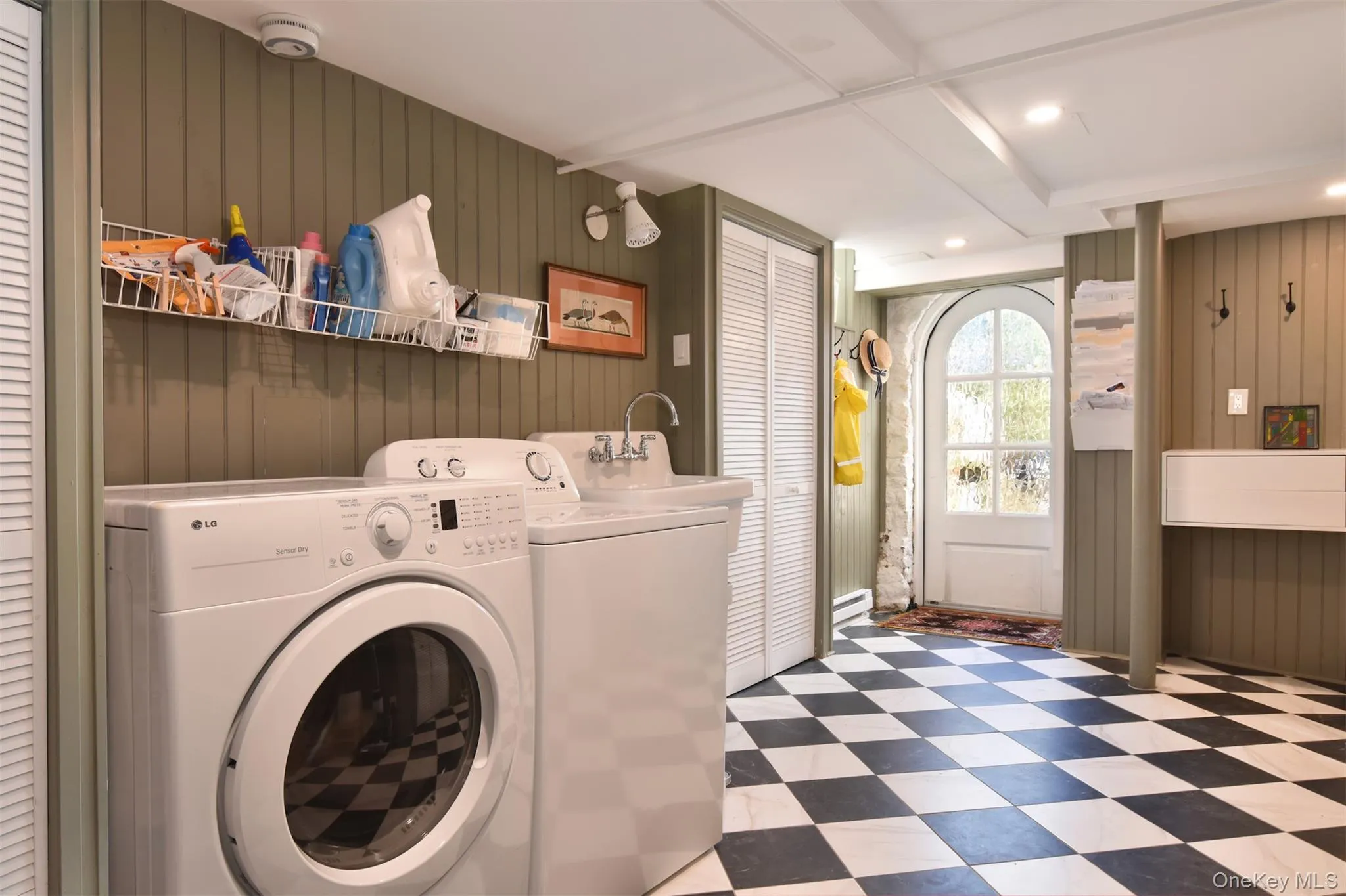 Large (282 sq. ft.) laundry/storage room adjacent to kitchen with private entrance. Large (282 sq. ft.) laundry/storage room adjacent to kitchen with private entrance.