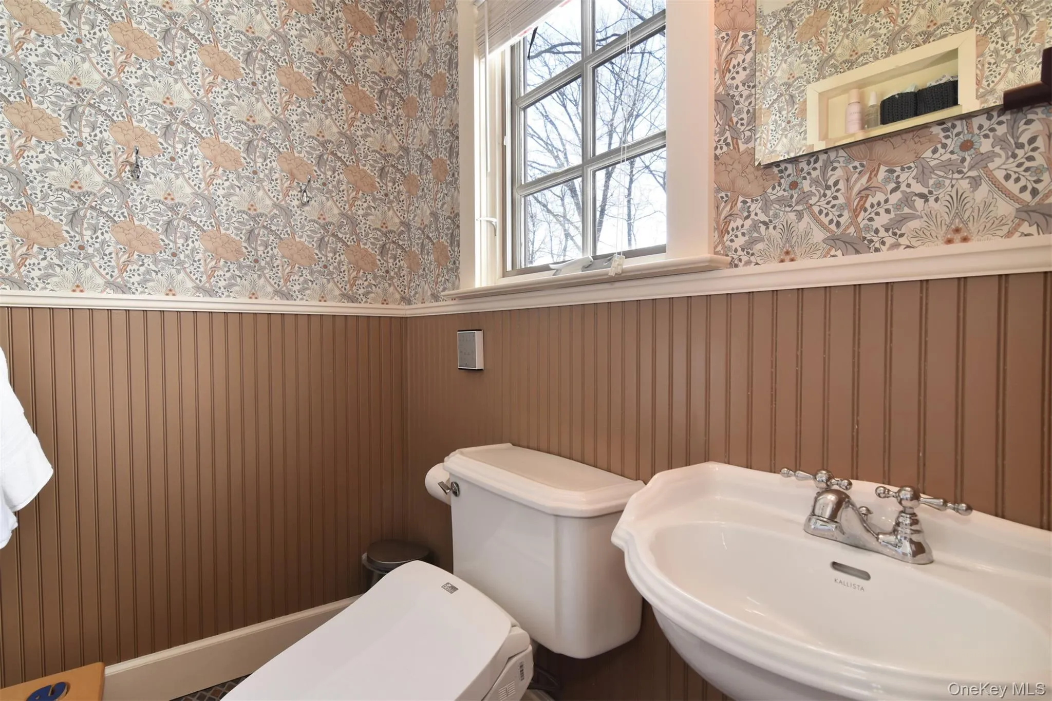 Half bath within primary bedroom suite. Half bath within primary bedroom suite.