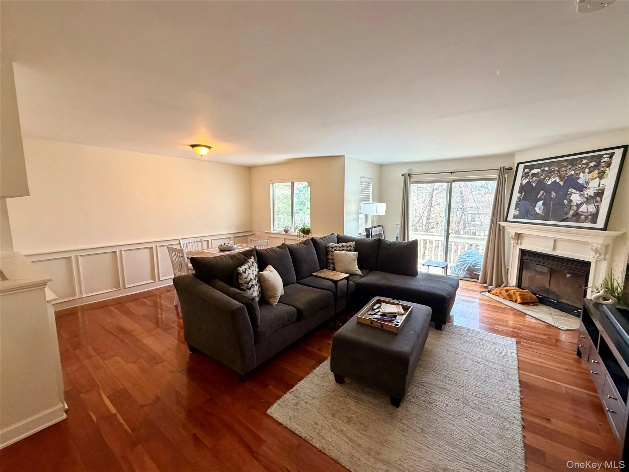 Spacious, light-filled, and full of character, the living room offers plenty of room to relax and entertain while overlooking the wooded courtyard below. Spacious, light-filled, and full of character, the living room offers plenty of room to relax and entertain while overlooking the wooded courtyard below.