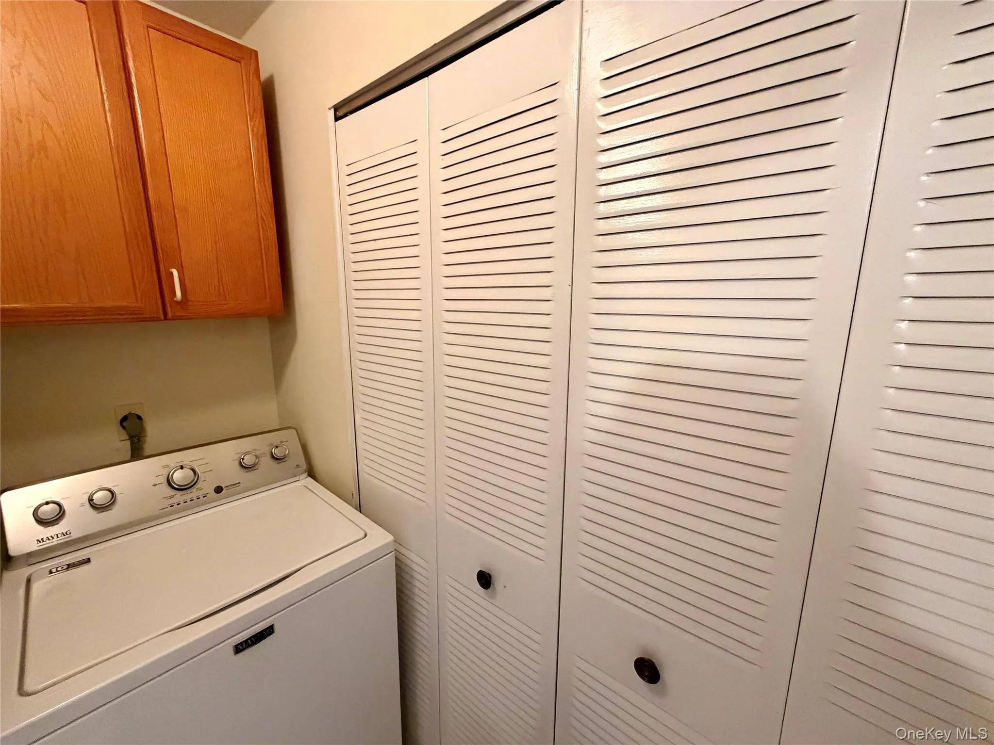 In-unit laundry is a rare convenience and is tucked into its own dedicated laundry room with overhead cabinet storage. In-unit laundry is a rare convenience and is tucked into its own dedicated laundry room with overhead cabinet storage.