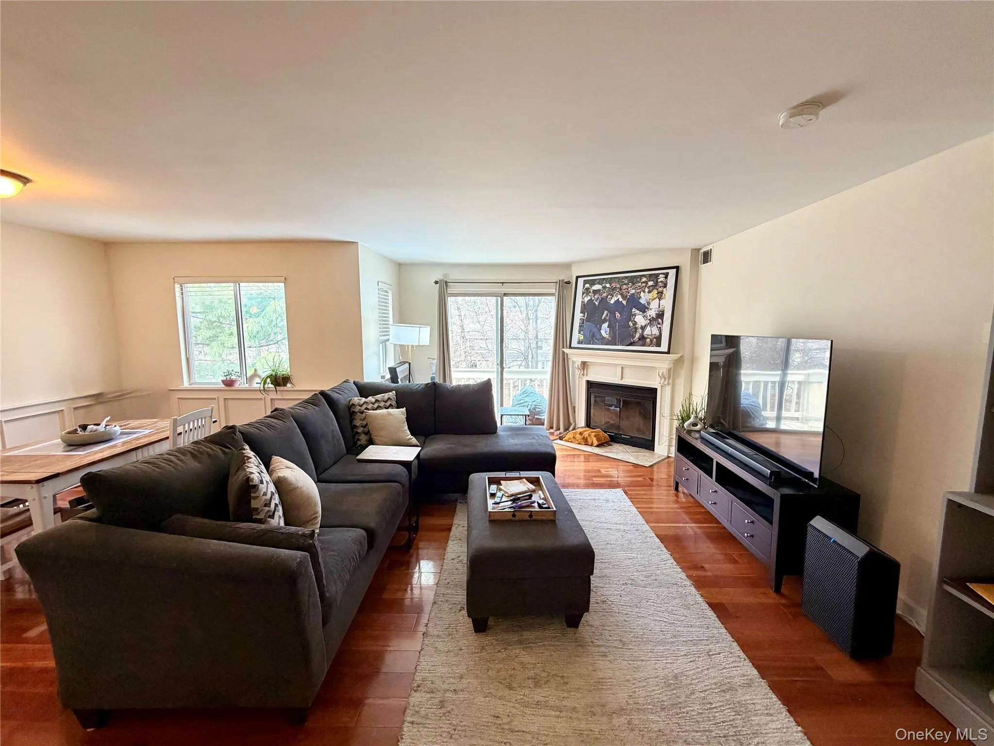 The living room is made for cozy nights in, centered around a working wood-burning fireplace with sliding glass doors leading directly out to the private balcony. The living room is made for cozy nights in, centered around a working wood-burning fireplace with sliding glass doors leading directly out to the private balcony.