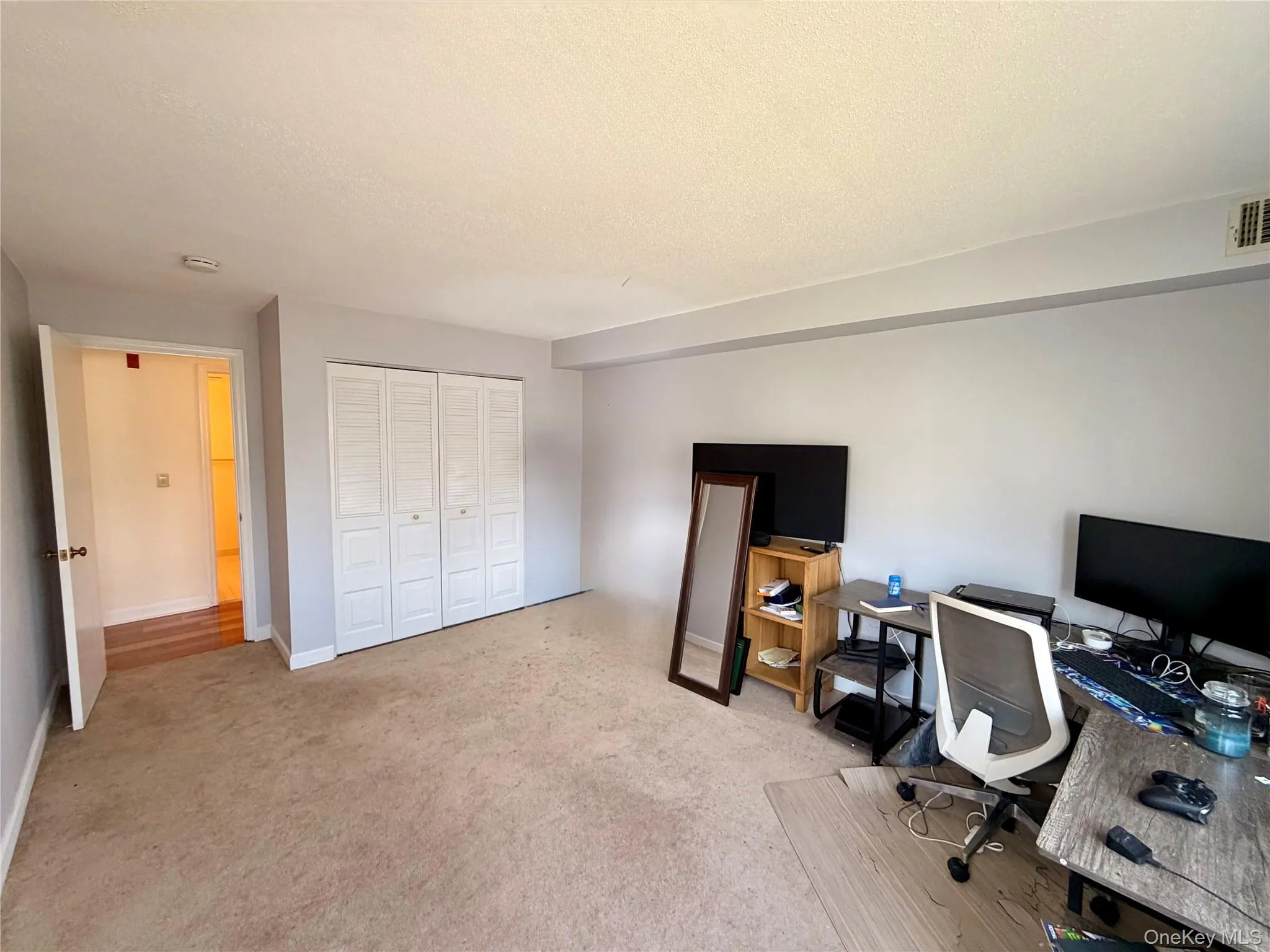 A large double-door closet and open floor plan make the second bedroom as functional as it is spacious, with easy access to the hallway and second bath. A large double-door closet and open floor plan make the second bedroom as functional as it is spacious, with easy access to the hallway and second bath.