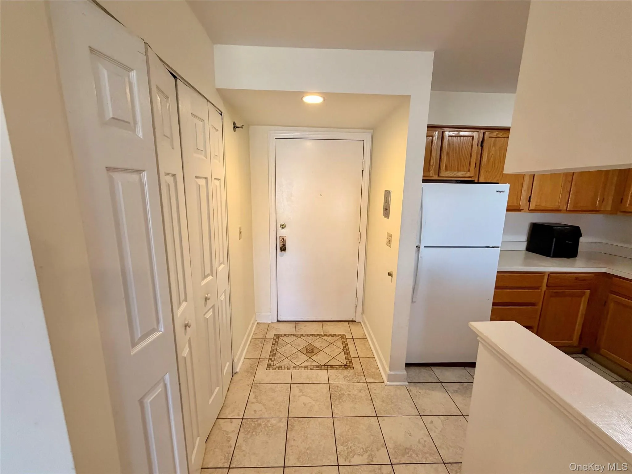 Step inside to a welcoming entry with a decorative tile inlay and a full double-door closet, with the kitchen conveniently positioned just off the front hall. Step inside to a welcoming entry with a decorative tile inlay and a full double-door closet, with the kitchen conveniently positioned just off the front hall.