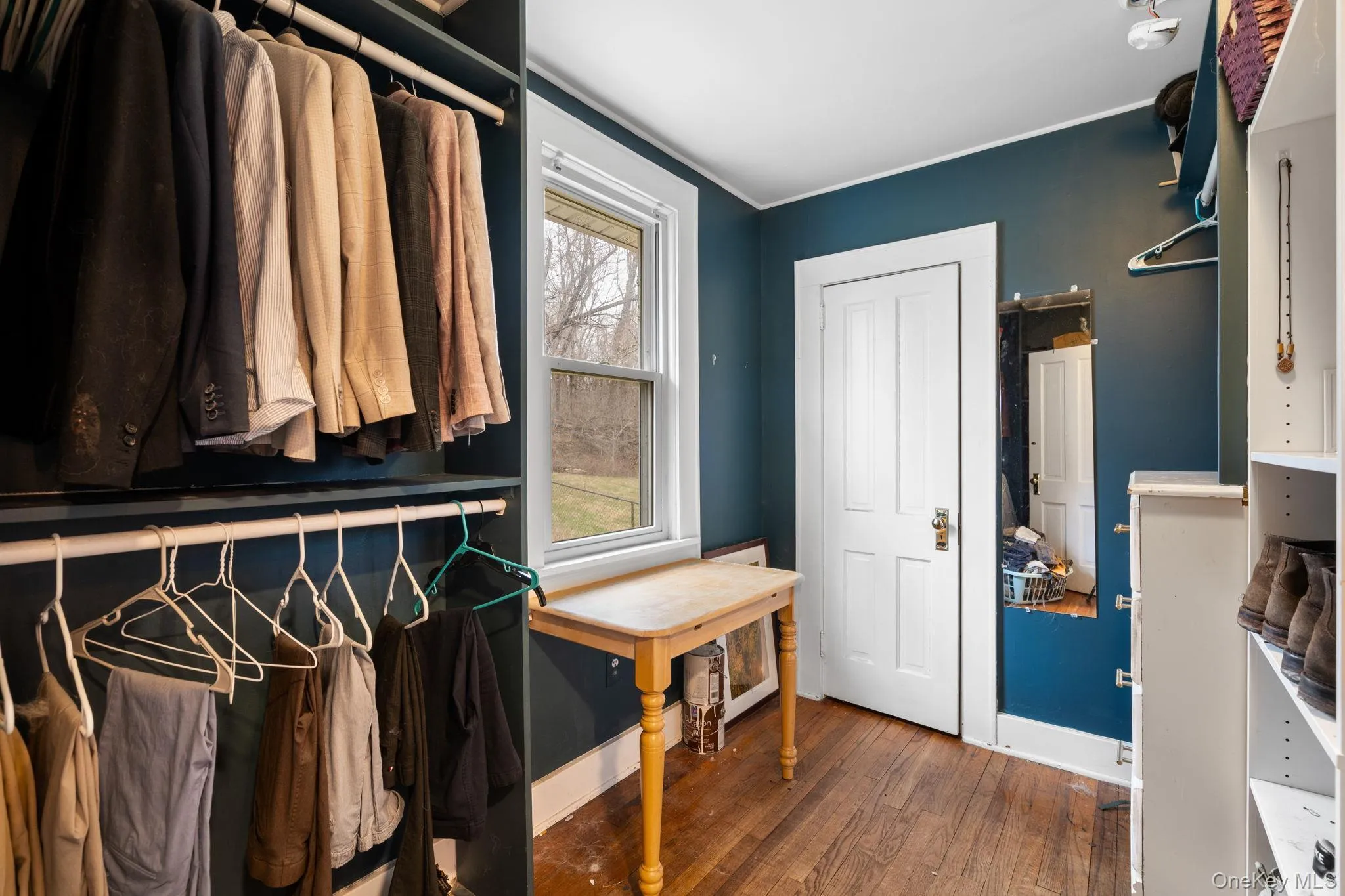 Walk-in closet could also be suitable for an office space. Walk-in closet could also be suitable for an office space.