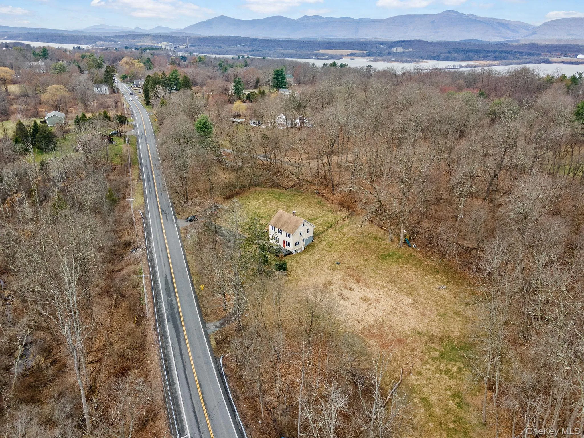 Arial view showing the open yard space and wooded area. Arial view showing the open yard space and wooded area.
