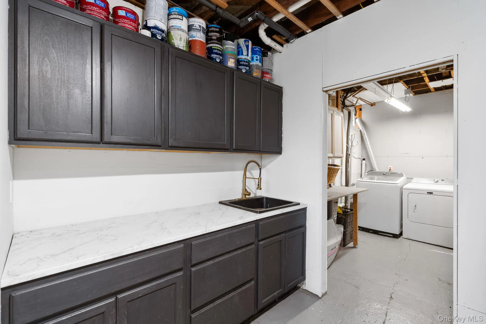 This flex space with it's own entrance provides access to the laundry room and additional storage. This flex space with it's own entrance provides access to the laundry room and additional storage.
