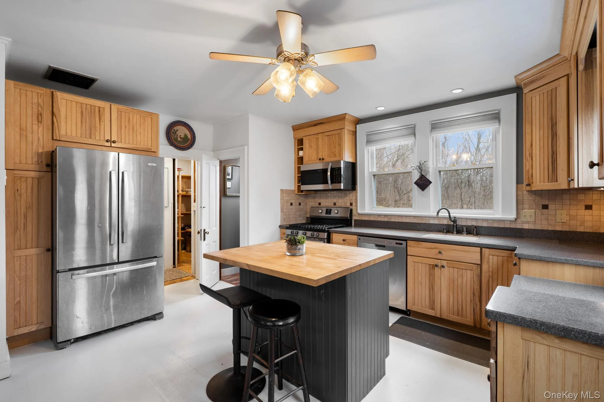 Eat-in kitchen also provides access to a large walk-in pantry. Eat-in kitchen also provides access to a large walk-in pantry.