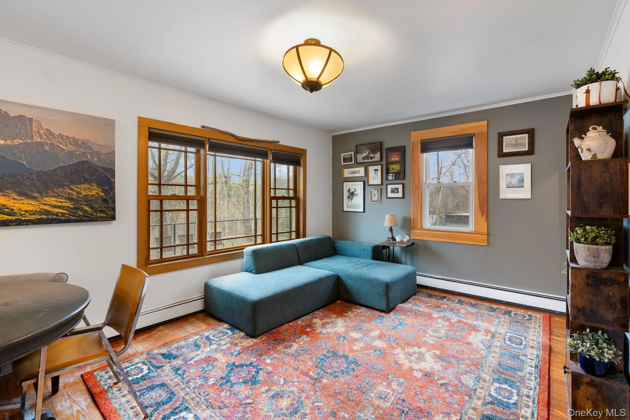 Living room with hardwood floors and natural light flowing throughout. Living room with hardwood floors and natural light flowing throughout.