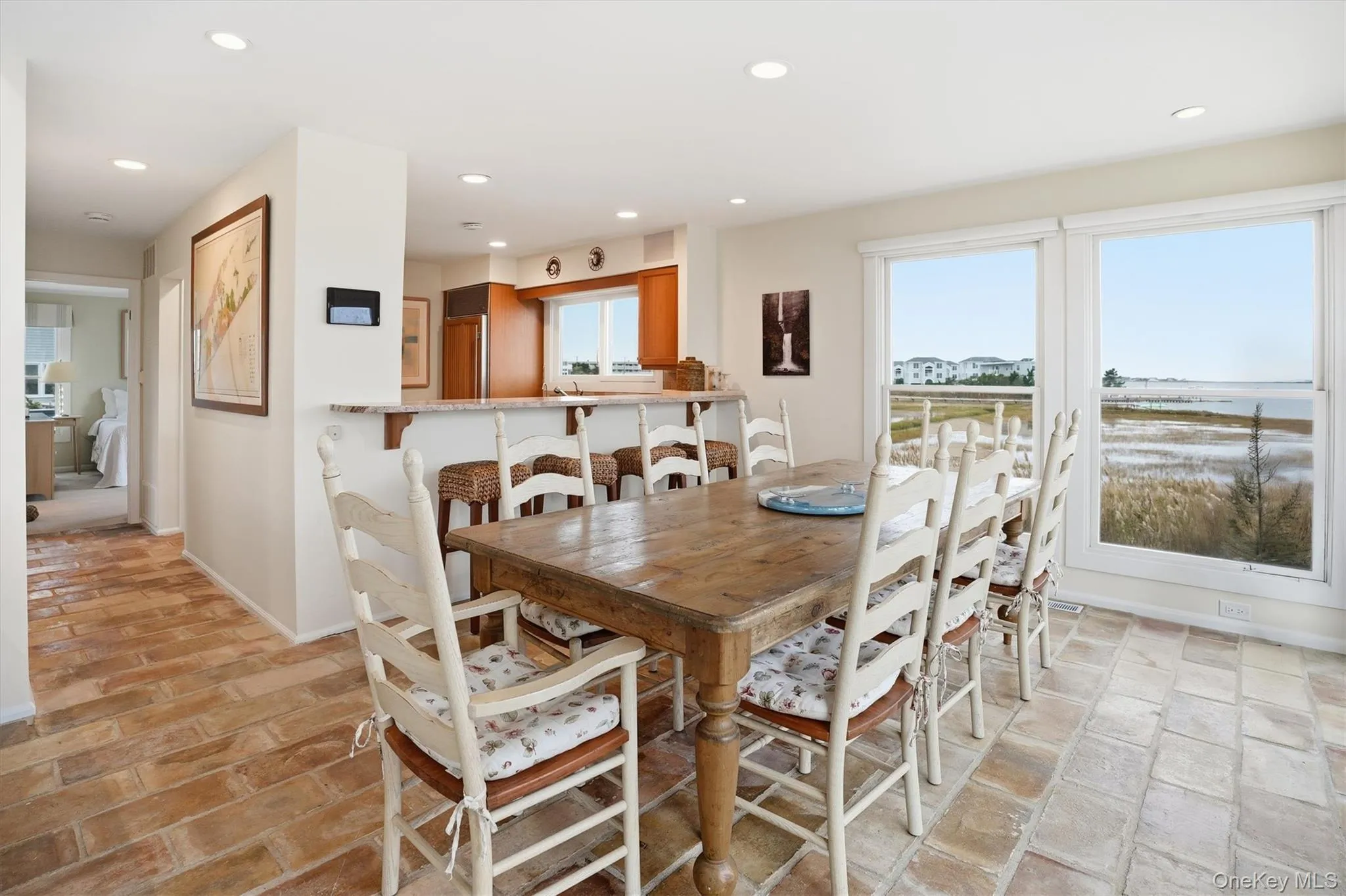 Dining room featuring recessed lighting and dramatic bay views Dining room featuring recessed lighting and dramatic bay views