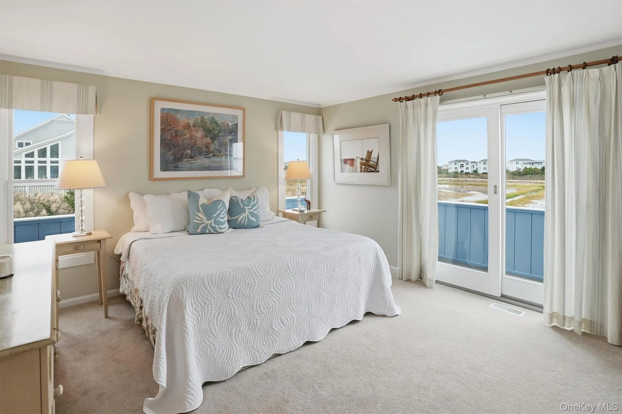 En-suite primary bedroom with balcony overlooking the bay and best sunsets! En-suite primary bedroom with balcony overlooking the bay and best sunsets!