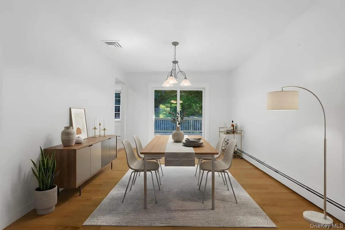Spacious Dining Room with sliding glass doors to wood Deck. Great flow for entertaining. Virtually Staged. Spacious Dining Room with sliding glass doors to wood Deck. Great flow for entertaining. Virtually Staged.