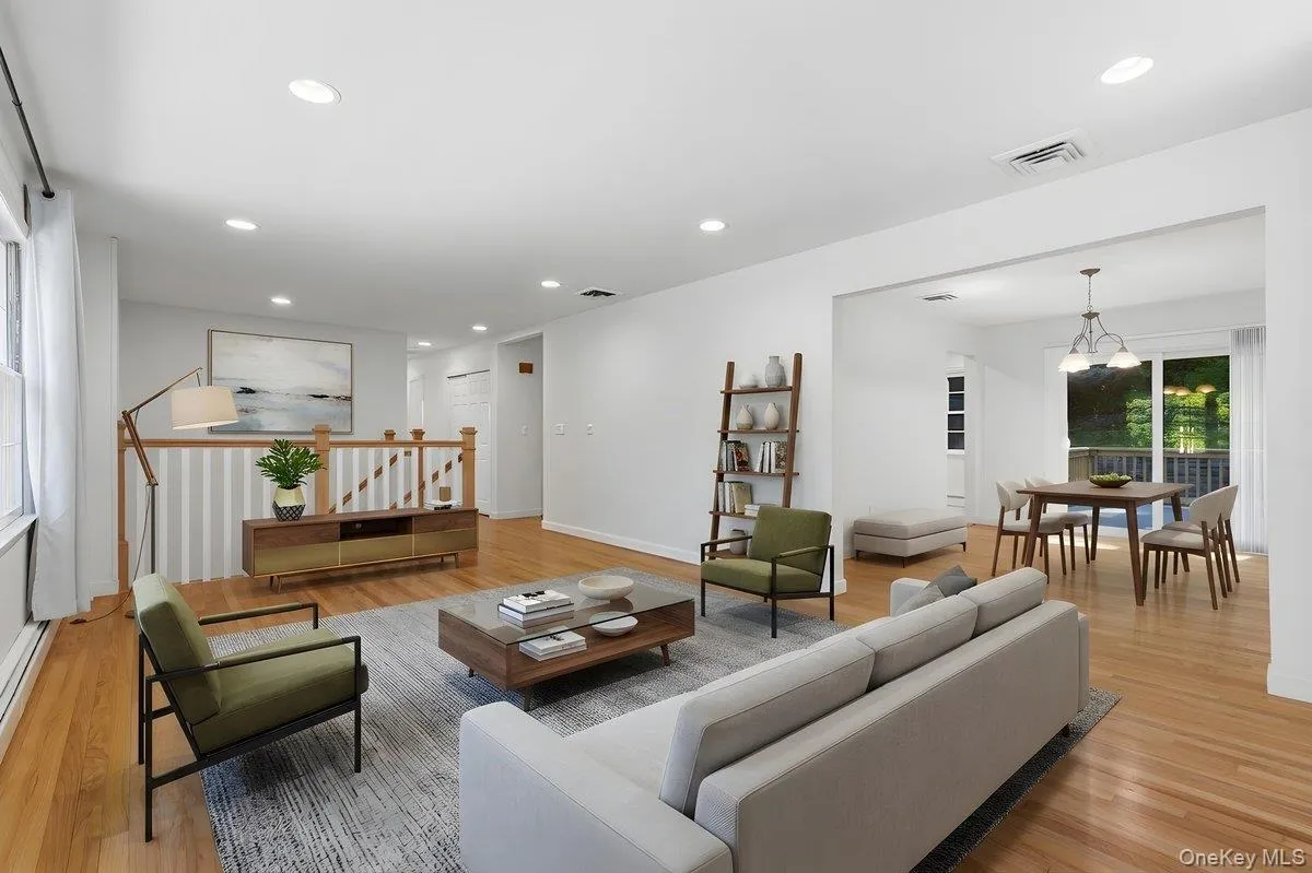 View of Living Room into Dining Room, both with gleaming hardwood floors. Virtually Staged. View of Living Room into Dining Room, both with gleaming hardwood floors. Virtually Staged.