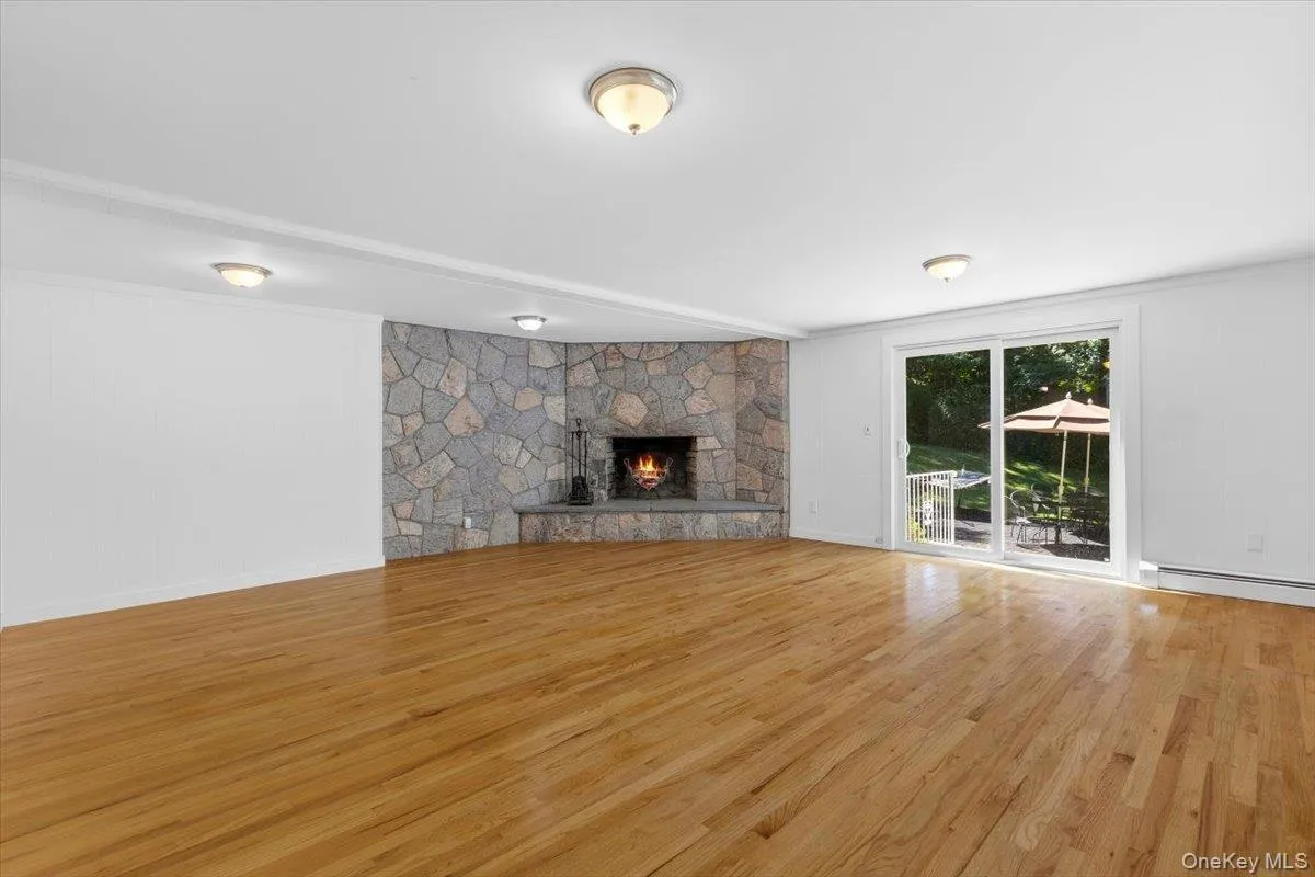 In the vast Family Room you can cozy up to the fireplace, step outside to the large outdoor patio or fill the room with a pool and ping pong table! Or Make a media room. Anything is possible in this space. In the vast Family Room you can cozy up to the fireplace, step outside to the large outdoor patio or fill the room with a pool and ping pong table! Or Make a media room. Anything is possible in this space.