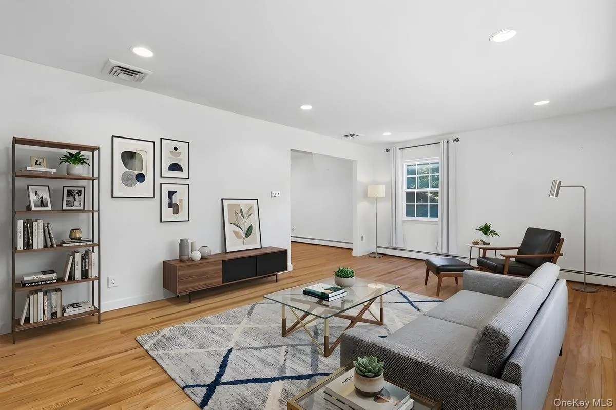 View of Living Room with recessed lights and hardwood floors. Virtually Staged. View of Living Room with recessed lights and hardwood floors. Virtually Staged.