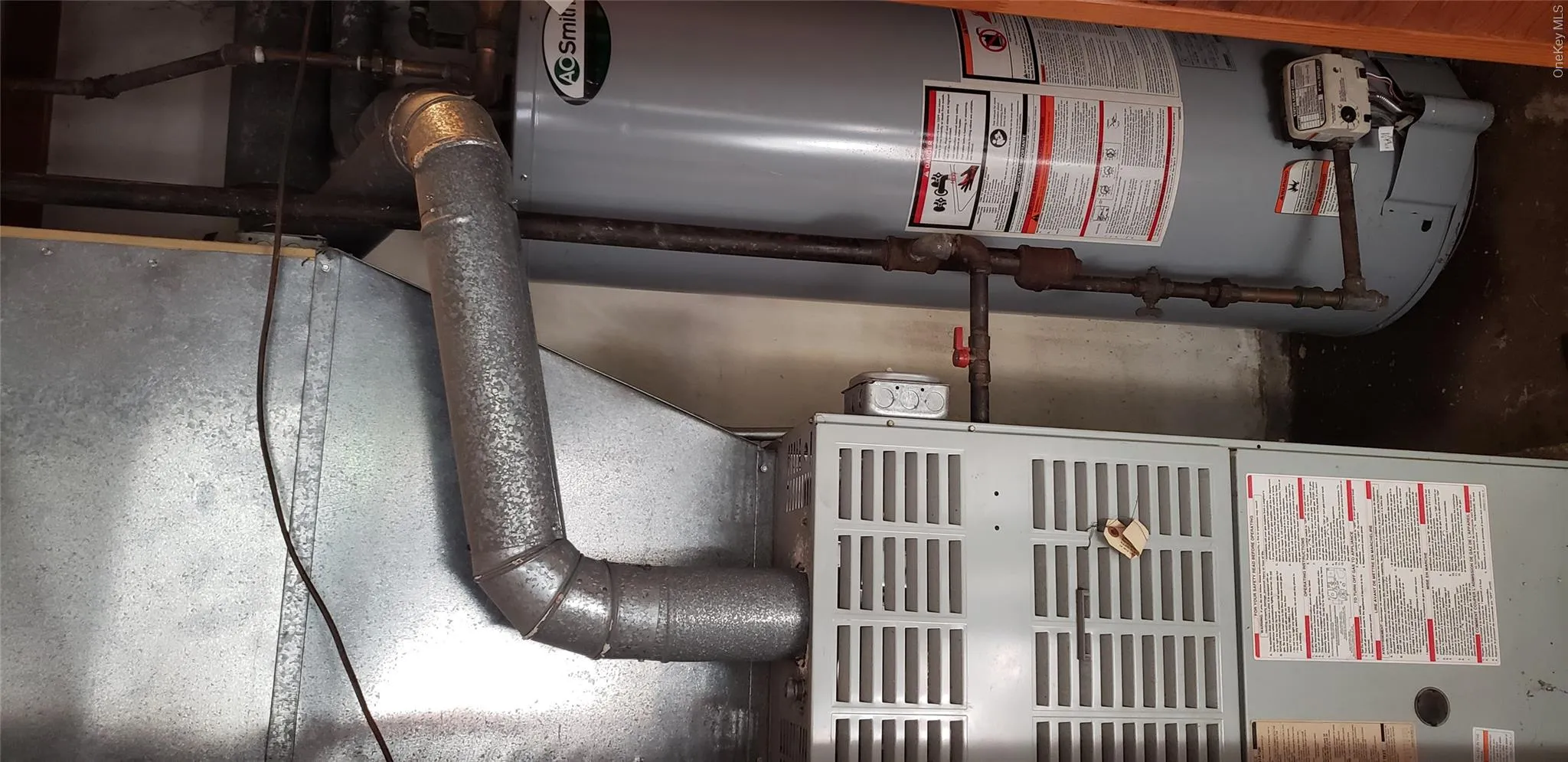Utilities featuring gas water heater and heating unit Utilities featuring gas water heater and heating unit