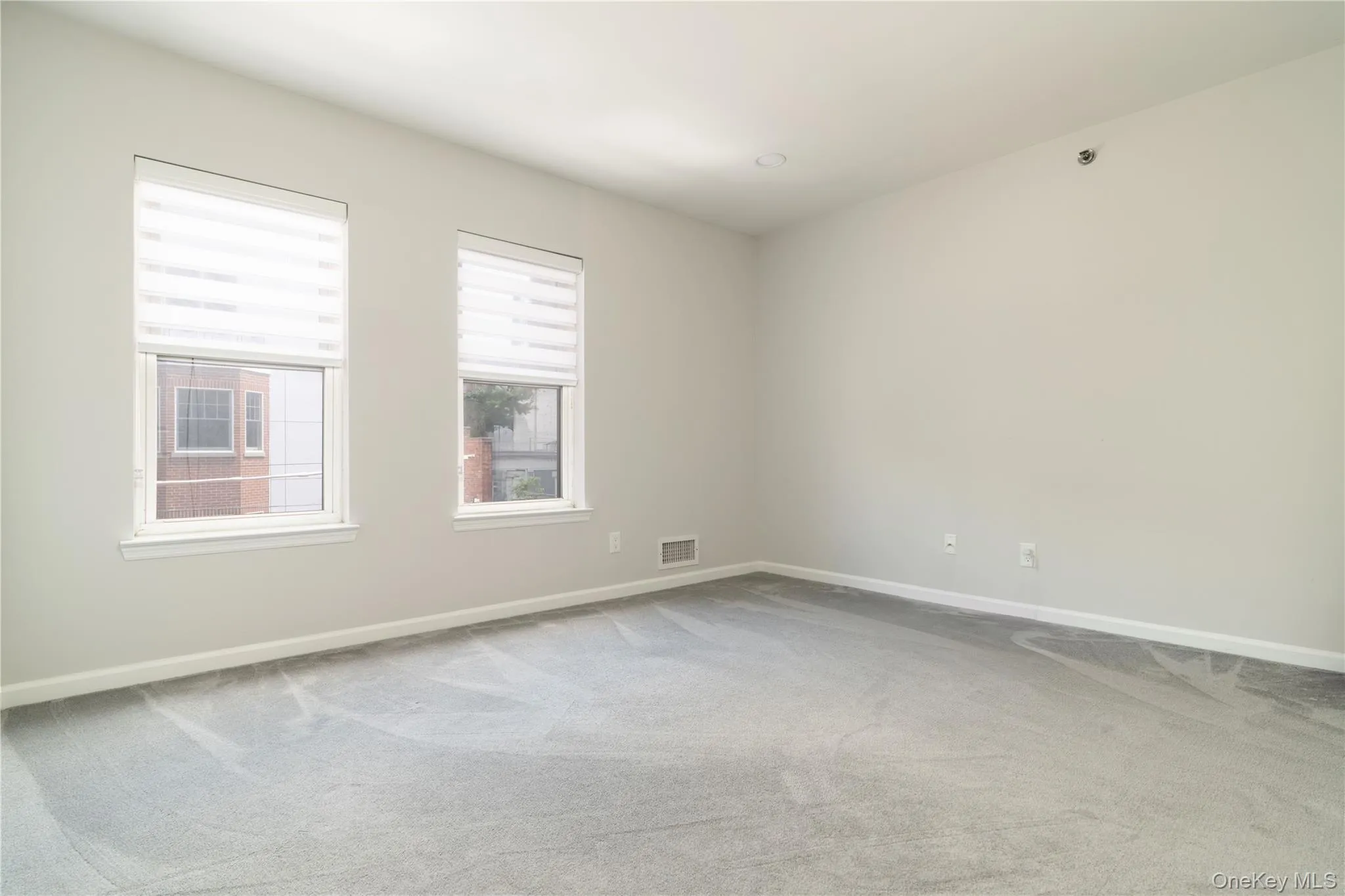 Spare room featuring carpet Spare room featuring carpet