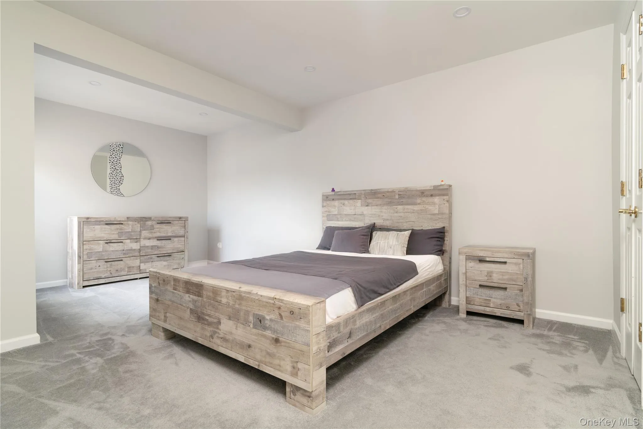 Carpeted bedroom featuring baseboards Carpeted bedroom featuring baseboards