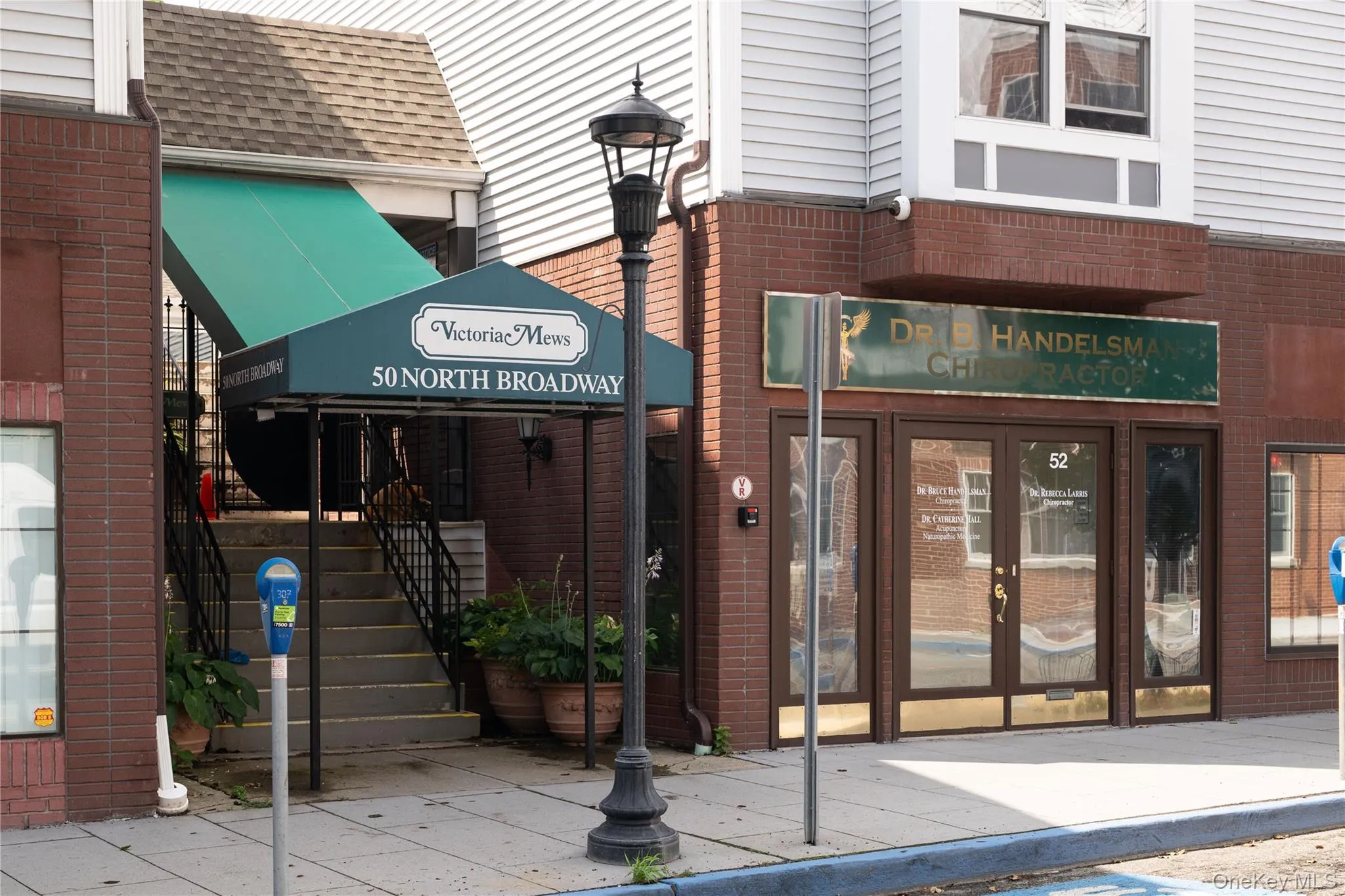 Property entrance with brick siding Property entrance with brick siding