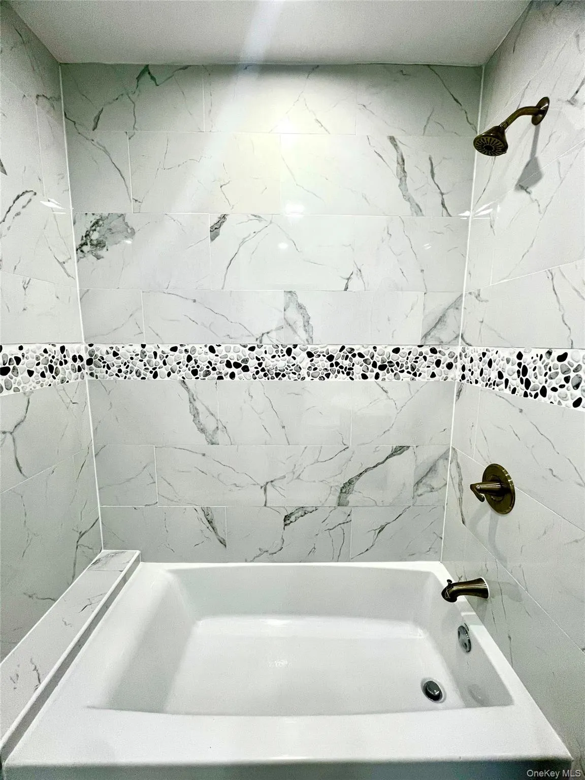 Full bath featuring bathtub / shower combination Full bath featuring bathtub / shower combination