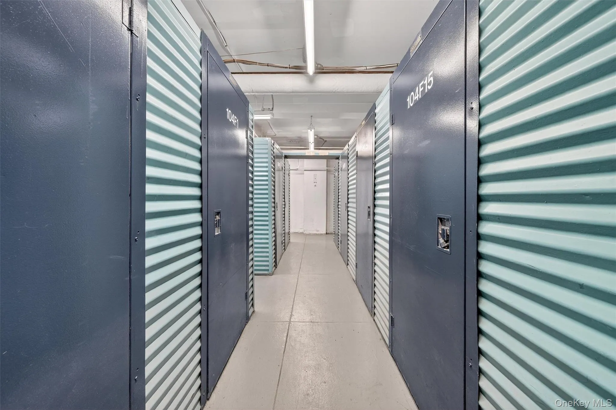 Hallway featuring concrete flooring Hallway featuring concrete flooring