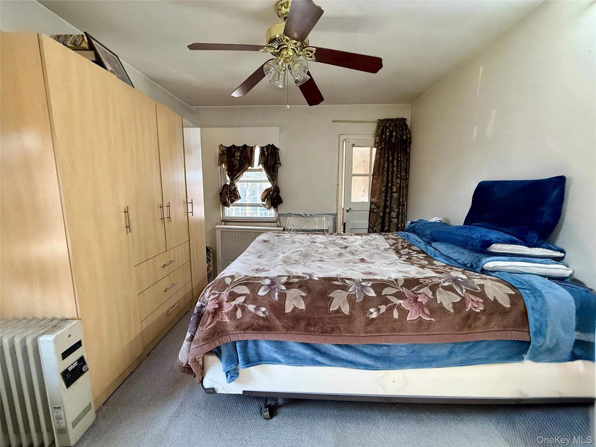 Bedroom facing the back of the house. This bedroom has access to a small balcony and terrace Bedroom facing the back of the house. This bedroom has access to a small balcony and terrace