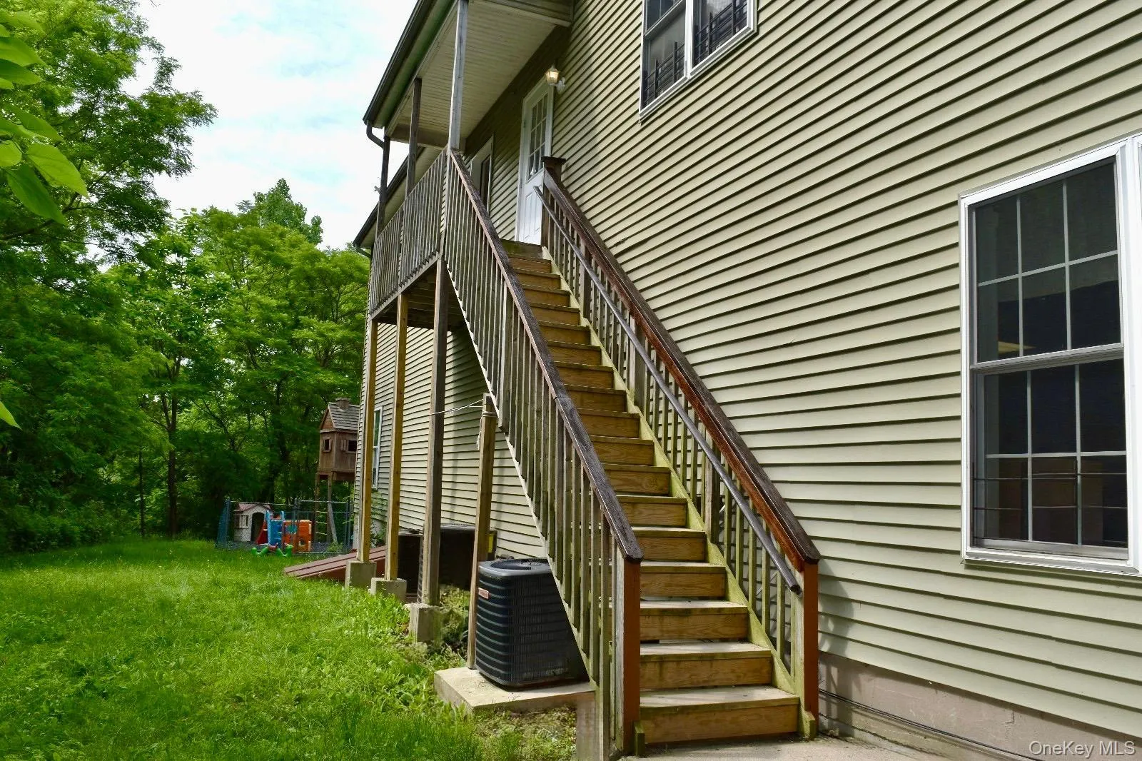 View of side of property with stairs and central air condition unit View of side of property with stairs and central air condition unit