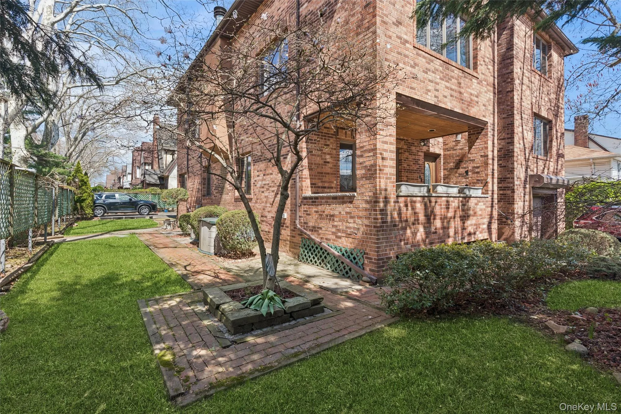 View of side of property featuring brick siding View of side of property featuring brick siding