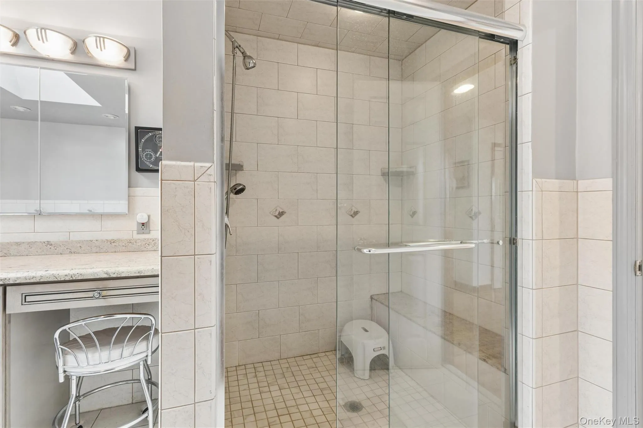 Master Bathroom Suite featuring a shower stall, tile walls, and vanity Master Bathroom Suite featuring a shower stall, tile walls, and vanity