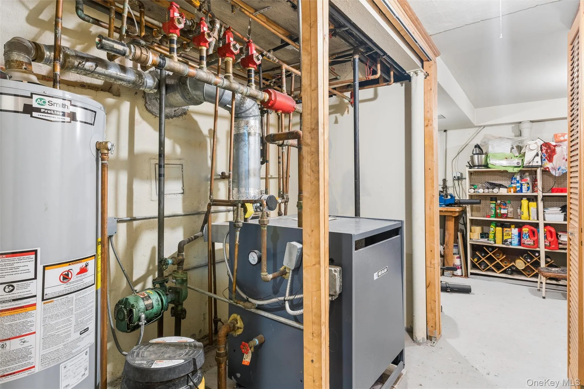 Utility room featuring gas water heater and a heating unit Utility room featuring gas water heater and a heating unit
