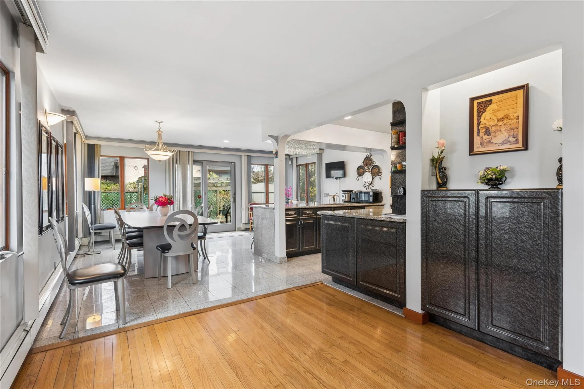 Kitchen featuring light wood-type flooring and pendant lighting Kitchen featuring light wood-type flooring and pendant lighting