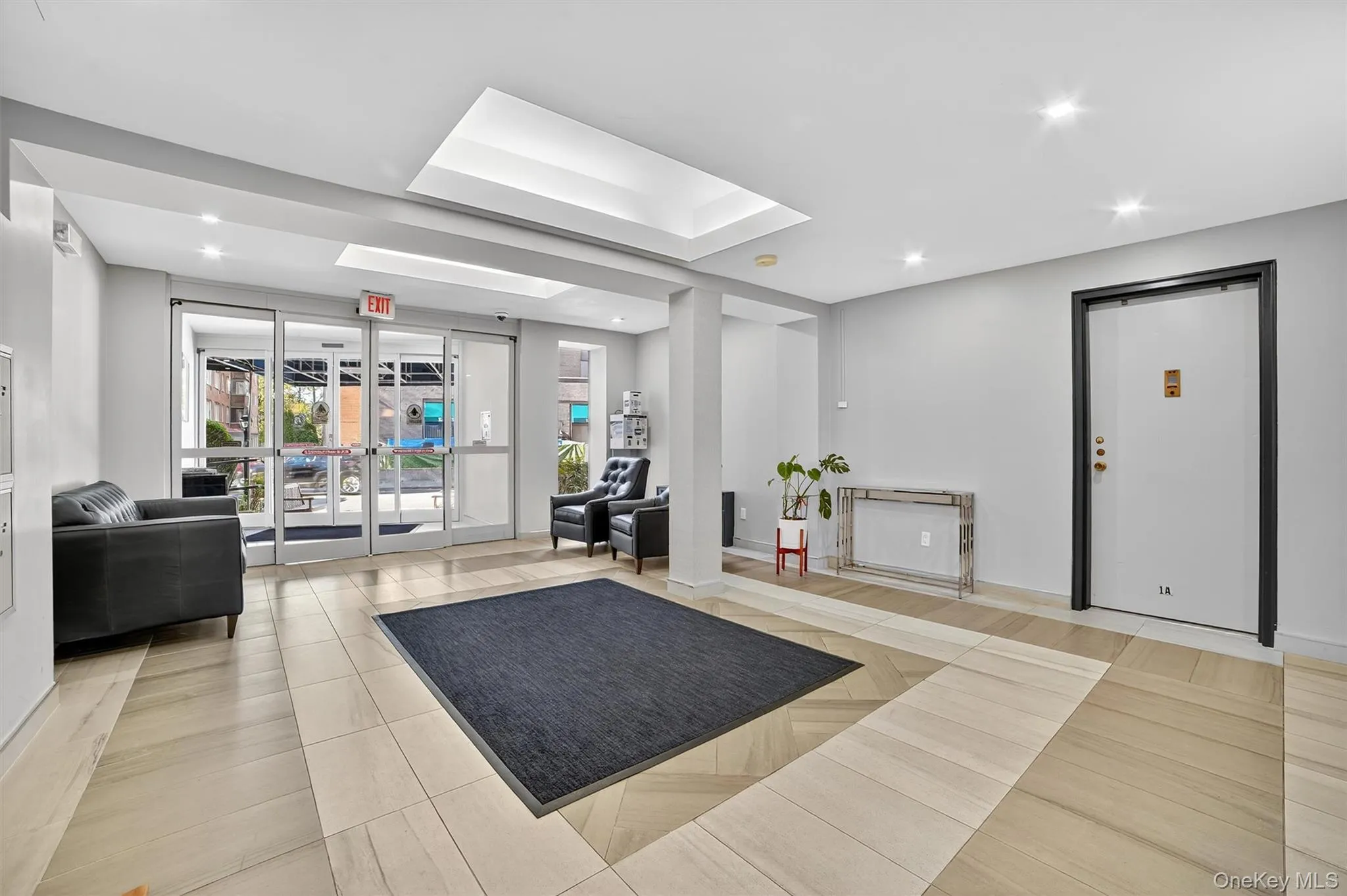 Community lobby featuring recessed lighting and a wall of windows Community lobby featuring recessed lighting and a wall of windows