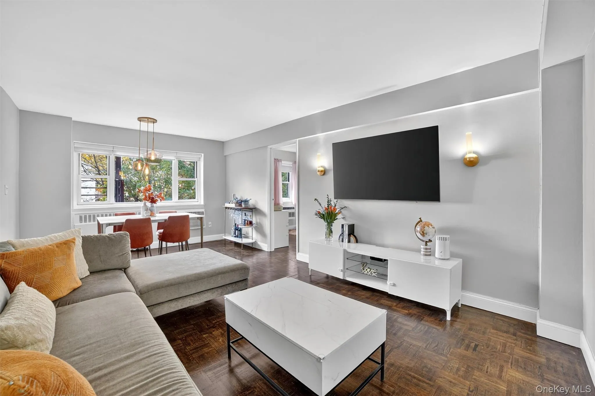 Spacious, bright and sunny living room with beautiful hardwood parquet floors. Spacious, bright and sunny living room with beautiful hardwood parquet floors.