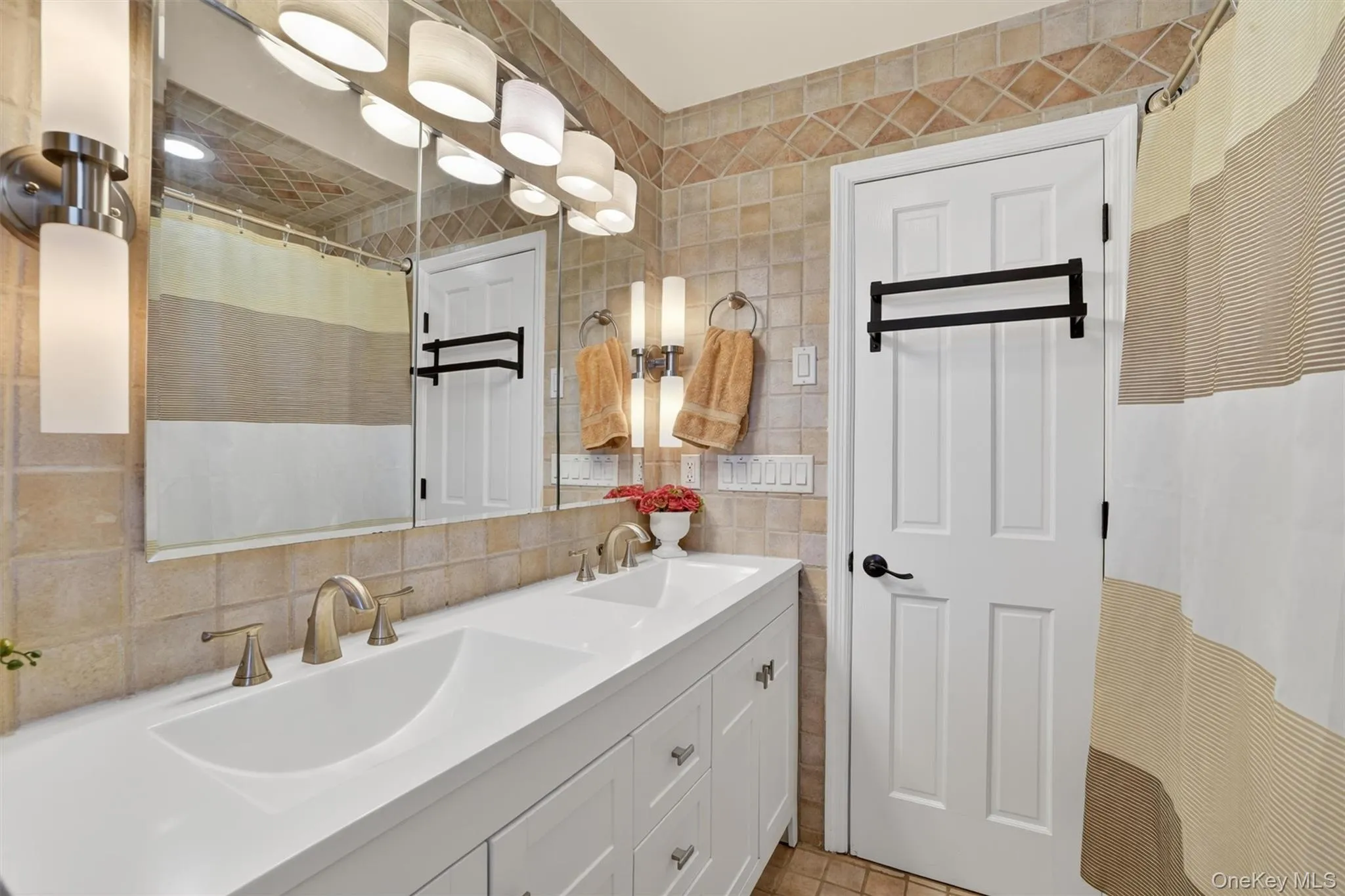 Oversized double sink vanity and upscale lighting Oversized double sink vanity and upscale lighting