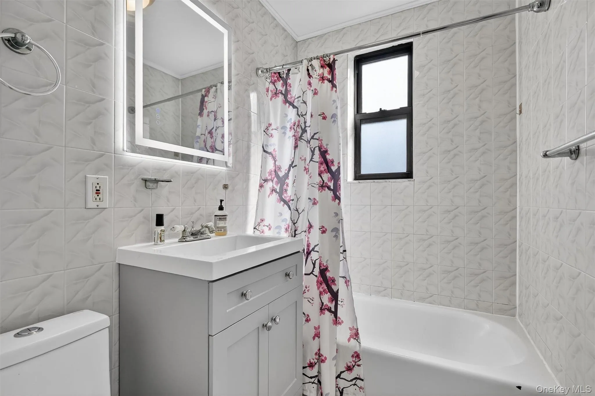Updated bathroom with new vanity and mirror. Updated bathroom with new vanity and mirror.