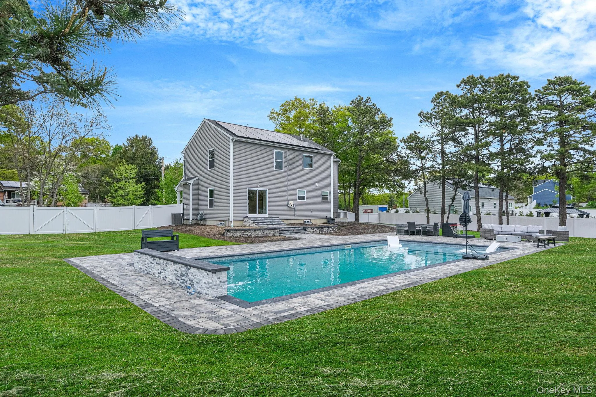 .52 acres with 44’ x 20’ gas-heated Jandy TruGuard mineral in-ground pool with a 10’ sundeck, lounge area, and gorgeous waterfall feature .52 acres with 44’ x 20’ gas-heated Jandy TruGuard mineral in-ground pool with a 10’ sundeck, lounge area, and gorgeous waterfall feature