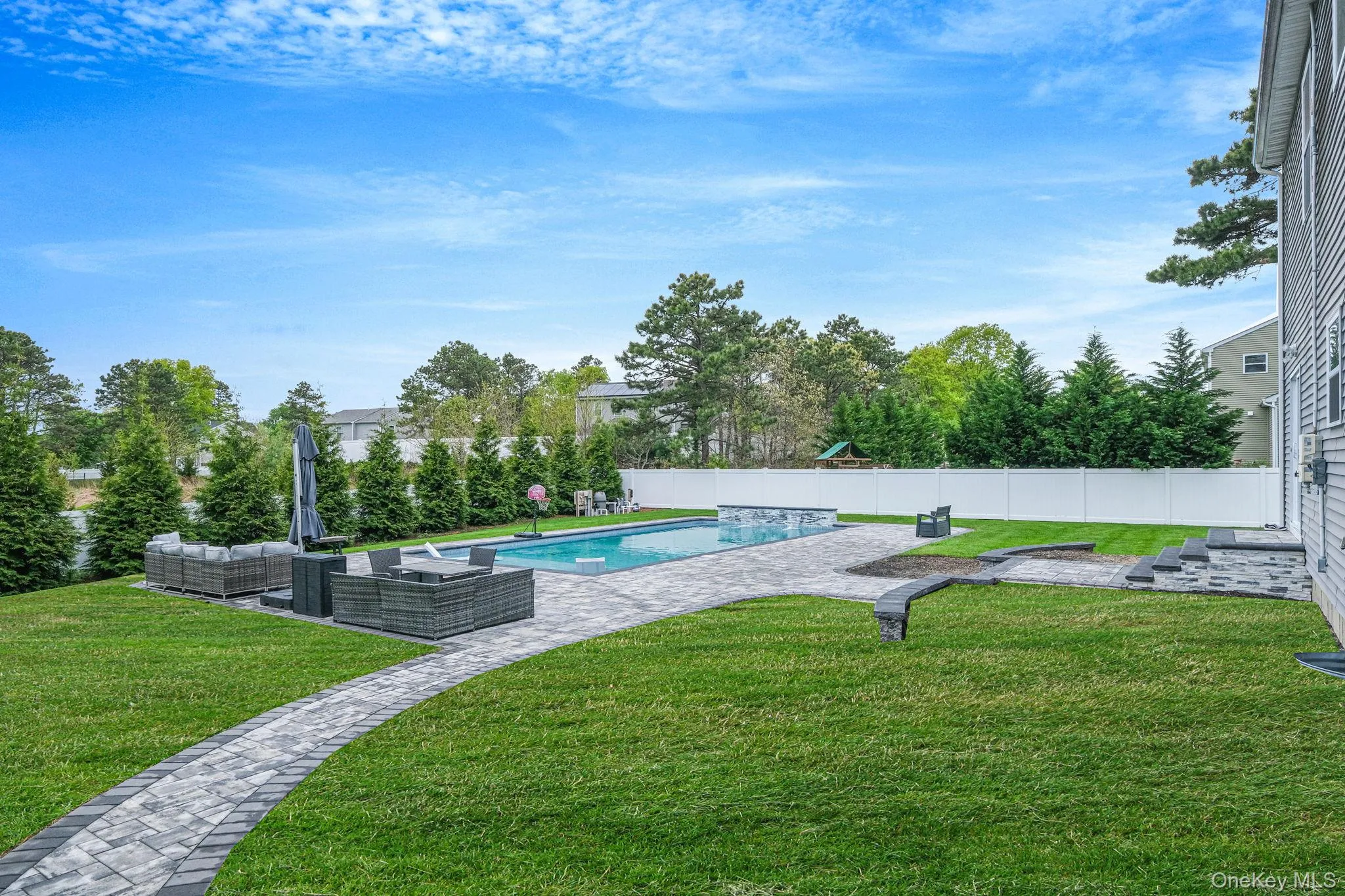 .52 acres with 44’ x 20’ gas-heated Jandy TruGuard mineral in-ground pool with a 10’ sundeck, lounge area, and gorgeous waterfall feature .52 acres with 44’ x 20’ gas-heated Jandy TruGuard mineral in-ground pool with a 10’ sundeck, lounge area, and gorgeous waterfall feature