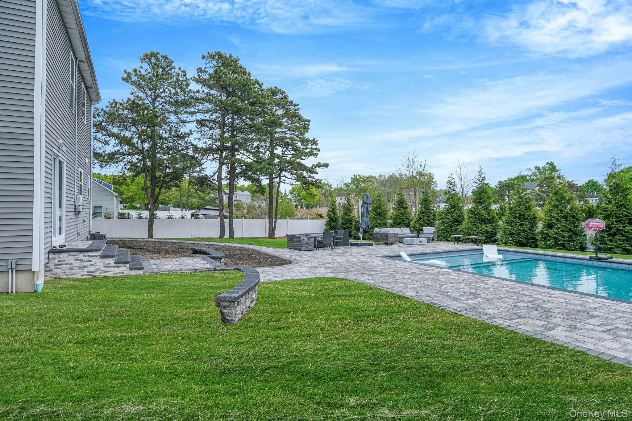 .52 acres with 44’ x 20’ gas-heated Jandy TruGuard mineral in-ground pool with a 10’ sundeck, lounge area, and gorgeous waterfall feature .52 acres with 44’ x 20’ gas-heated Jandy TruGuard mineral in-ground pool with a 10’ sundeck, lounge area, and gorgeous waterfall feature
