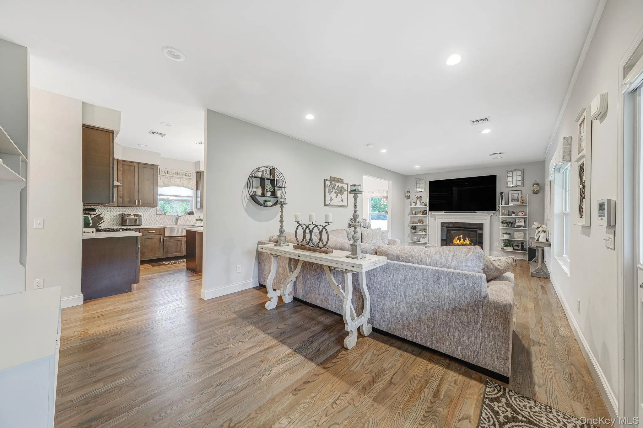 Spacious LR with HW Floors, Gas Fireplace, Recessed Lighting, Open Flow to EIK and Formal DR Spacious LR with HW Floors, Gas Fireplace, Recessed Lighting, Open Flow to EIK and Formal DR