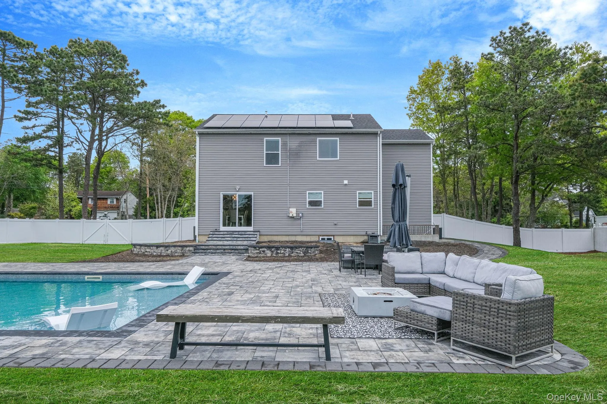 .52 acres with 44’ x 20’ gas-heated Jandy TruGuard mineral in-ground pool with a 10’ sundeck, lounge area, and gorgeous waterfall feature .52 acres with 44’ x 20’ gas-heated Jandy TruGuard mineral in-ground pool with a 10’ sundeck, lounge area, and gorgeous waterfall feature