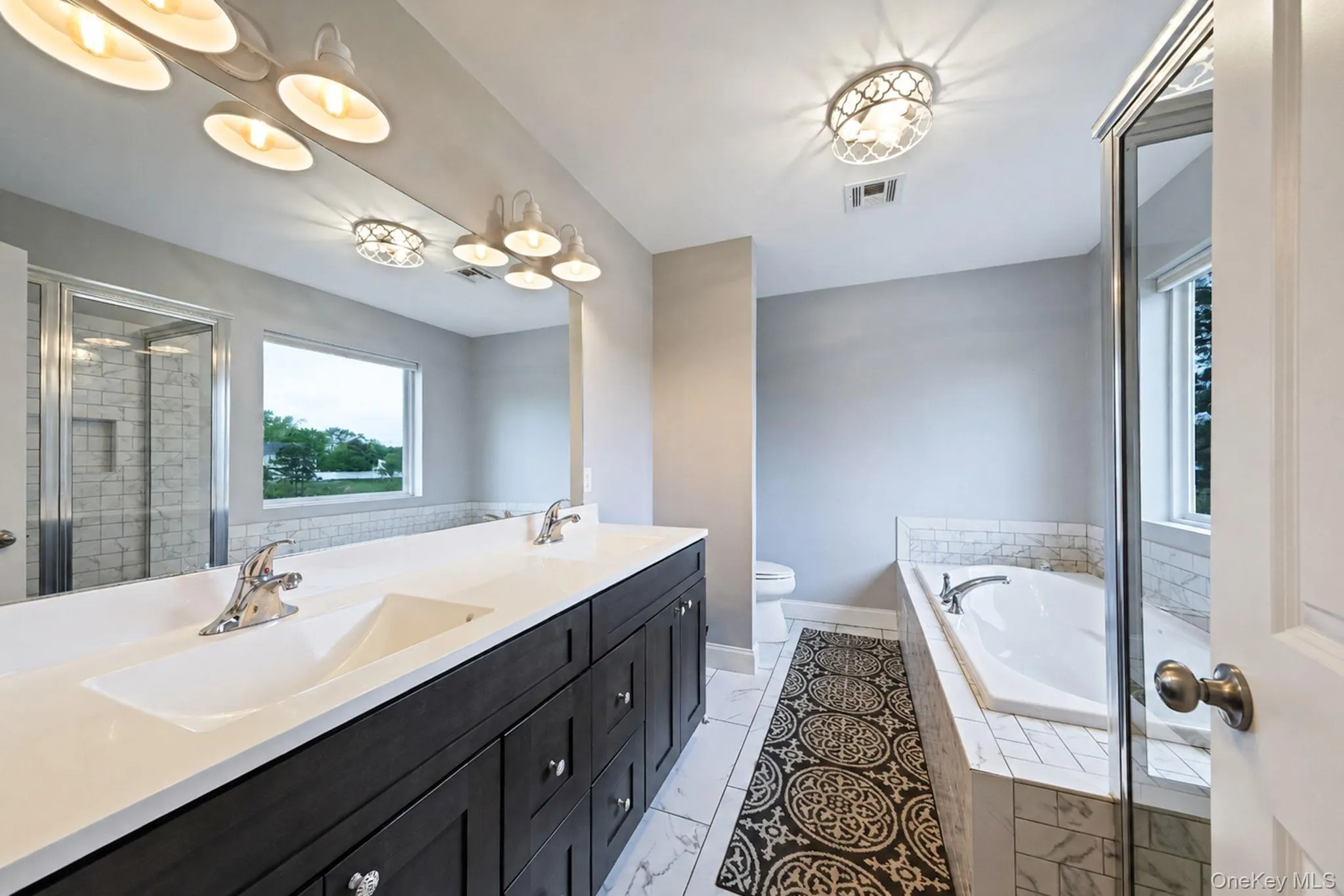 Primary En-Suite Bathroom with Dual Vanity, Walk In Shower, Separate Tub Primary En-Suite Bathroom with Dual Vanity, Walk In Shower, Separate Tub